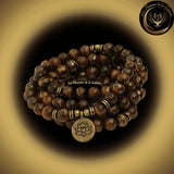 Oeil de Tigre - Très beau bracelet Mala Tibétain - Lotus / Bouddha / OM - 108 perles - 8 mm chez Les Flammes de la Lumière